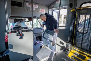 After shopping at The Corner Store, Whitehall resident Bruce Ball boards a Whitehall Public Transportation bus driven by LeRoy Murphy Feb. 21, 2020. (Ball has since passed away.) After shopping at The Corner Store, Whitehall resident Bruce Ball boards a Whitehall Public Transportation bus driven by LeRoy Murphy Feb. 21, 2020. (Ball has since passed away.)