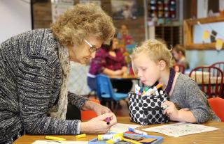 Pearl Hawkins colors with preschooler Kaylee Homen Jan. 10, 2020. Hawkins said she finds coloring relaxing, and enjoys the activity with students because she learns about them while they work together.
