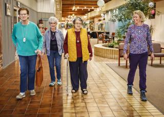 From left, Grace Larson, Joedy Foster, Dorothy Carr and Sue Carpenter of My Glacier Village walk together around the Gateway Community Center in Kalispell on March 3, 2020.